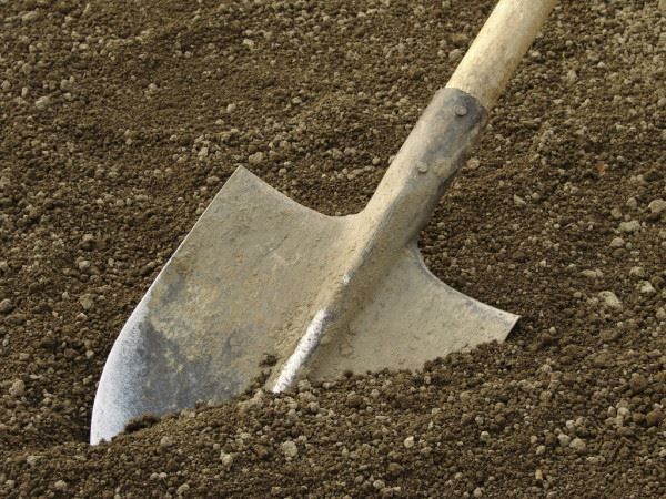 Ground breaking shovel dirt